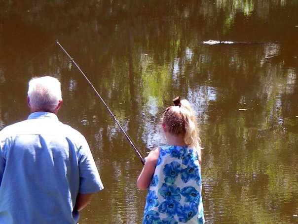 Eddiegator watching Nat and Paw Paw fish.jpg